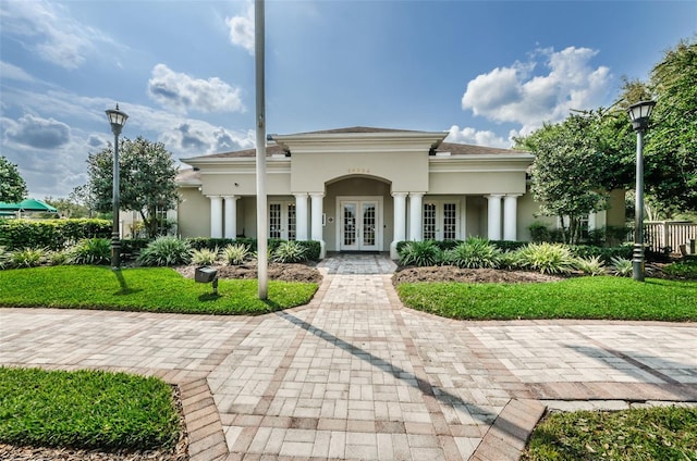 view of front of property featuring french doors and stucco siding