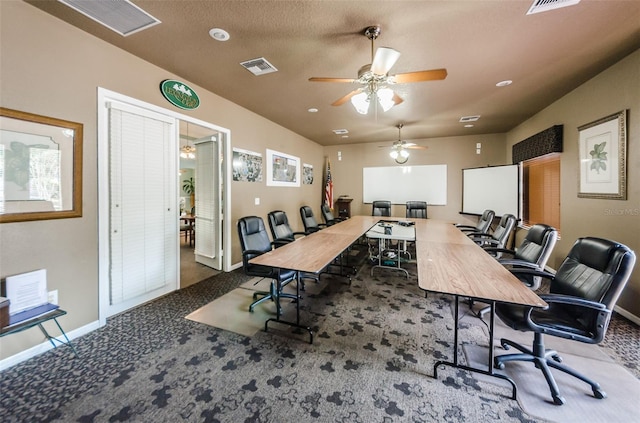 office with visible vents, baseboards, a ceiling fan, carpet, and a textured ceiling