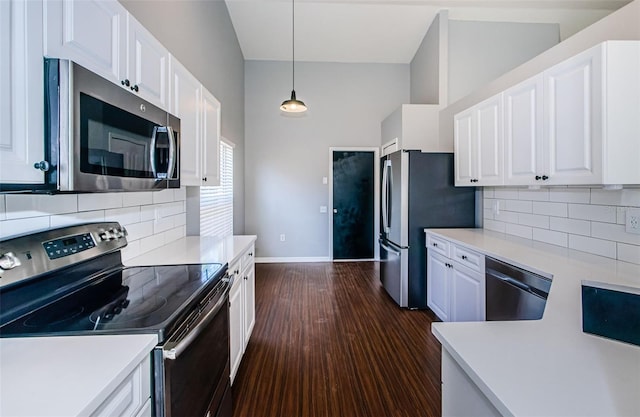 kitchen featuring appliances with stainless steel finishes, light countertops, and white cabinetry