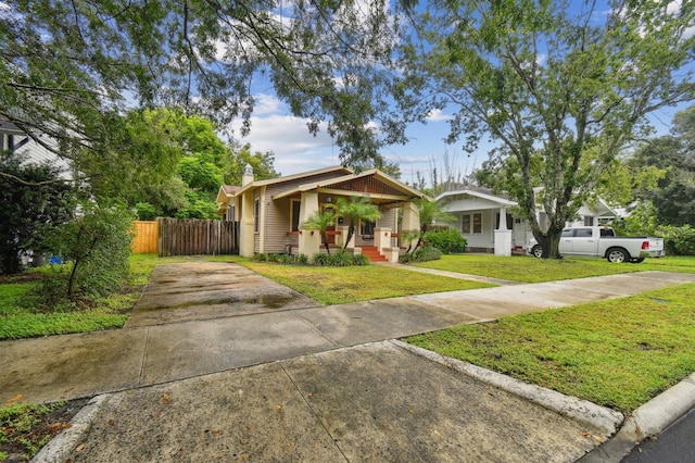 view of front facade with a front lawn and a porch