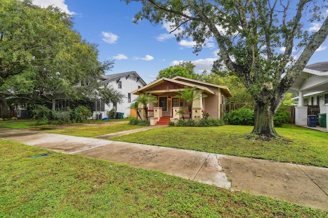 view of front of home featuring a porch and a front yard