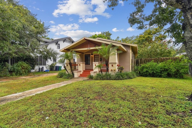 view of front of home featuring a front lawn and a porch