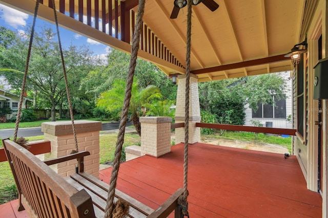 exterior space featuring ceiling fan