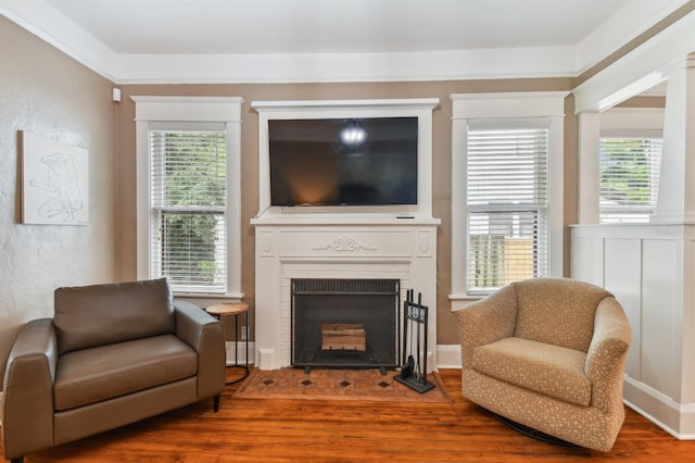 living area with hardwood / wood-style flooring