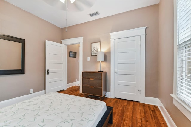 bedroom with wood-type flooring and ceiling fan