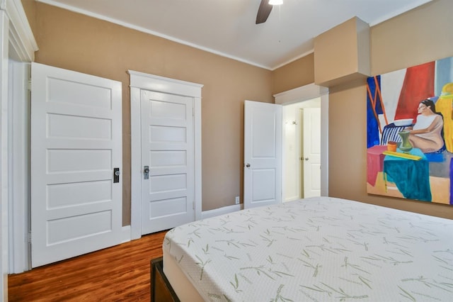 bedroom featuring hardwood / wood-style flooring and ceiling fan