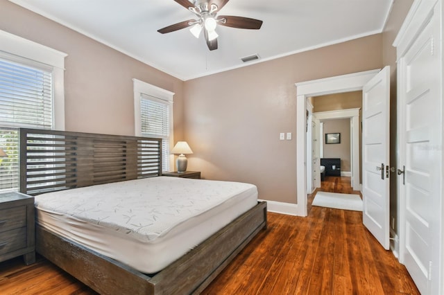 bedroom with ceiling fan and dark hardwood / wood-style floors