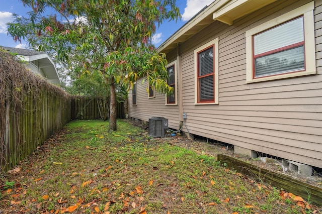 view of yard with central AC unit