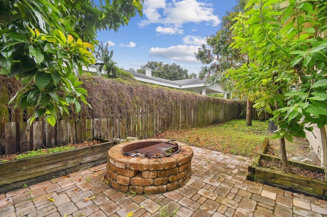 view of patio / terrace featuring a fire pit