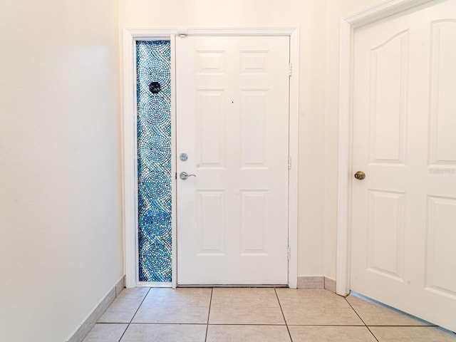 entrance foyer featuring light tile patterned floors