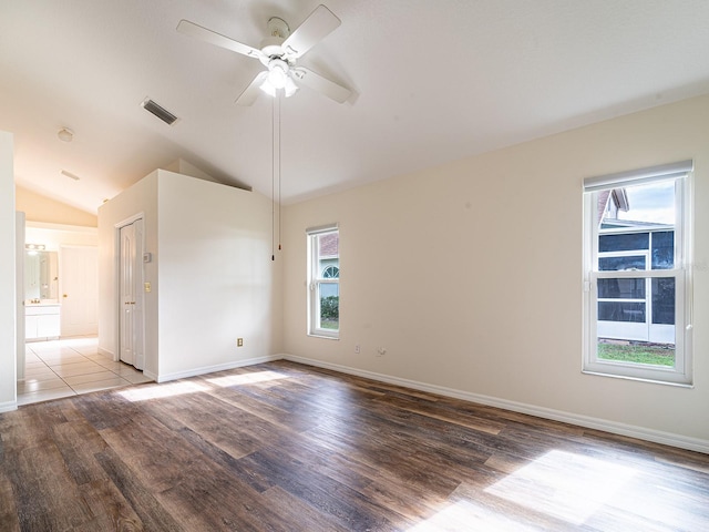 spare room featuring ceiling fan, wood-type flooring, and lofted ceiling