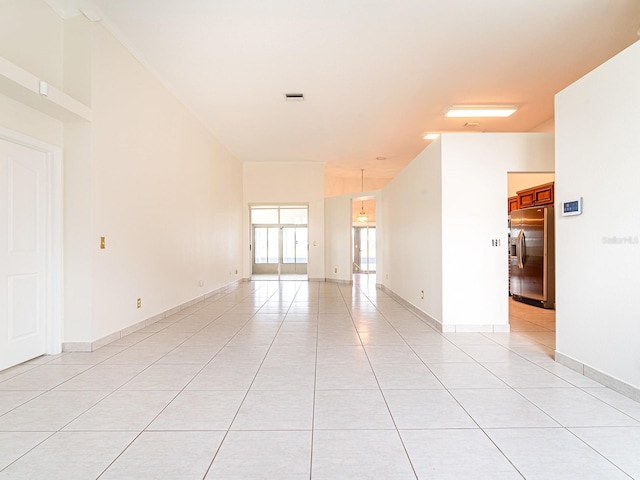 empty room featuring light tile patterned floors