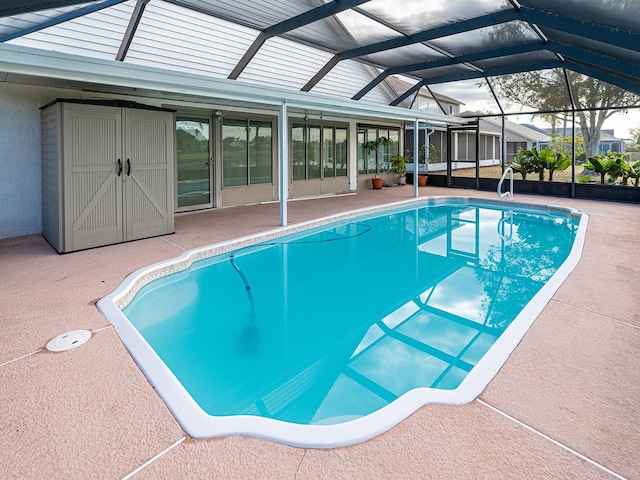 view of swimming pool featuring a lanai and a patio