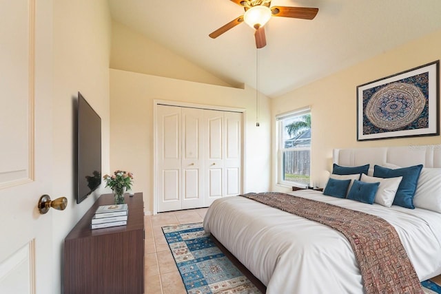 1515 Lions Club Dr, Brandon, FL 33511 - bedroom with light tile patterned flooring, vaulted ceiling, a closet, and a ceiling fan