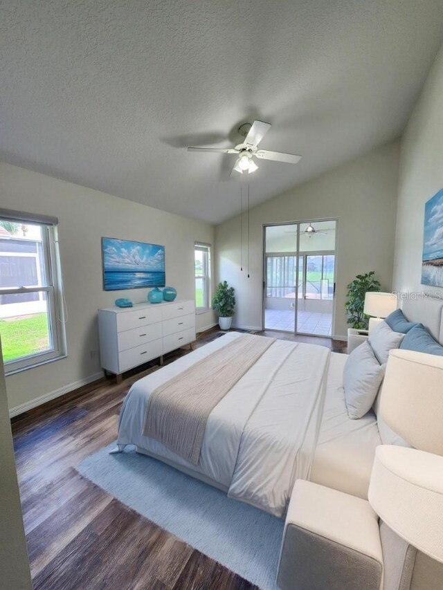 1515 Lions Club Dr, Brandon, FL 33511 - bedroom featuring wood finished floors, access to exterior, vaulted ceiling, baseboards, and a textured ceiling