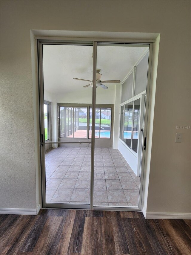 1515 Lions Club Dr, Brandon, FL 33511 - empty room with wood finished floors, ceiling fan, and baseboards