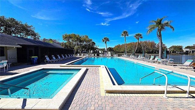 view of swimming pool featuring a patio area