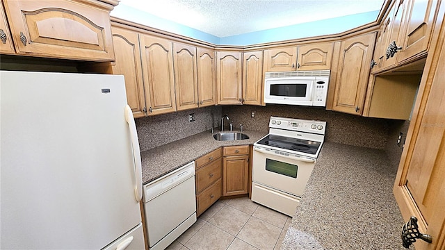 kitchen with sink, tasteful backsplash, a textured ceiling, white appliances, and light tile patterned flooring