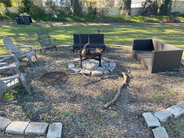 view of yard with a fire pit