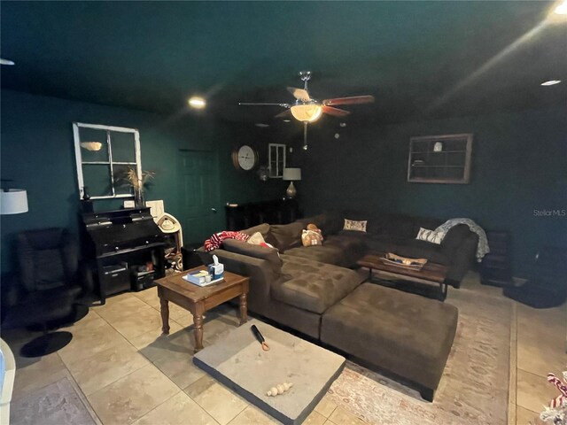 living room featuring ceiling fan and light tile patterned flooring