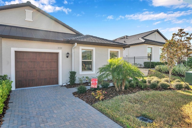 ranch-style house featuring a garage