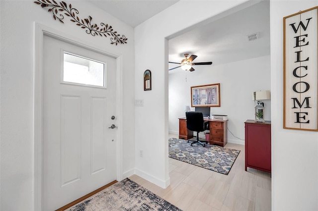 entrance foyer featuring ceiling fan