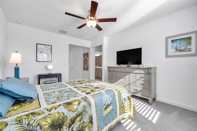 bedroom featuring ensuite bath, ceiling fan, and carpet floors