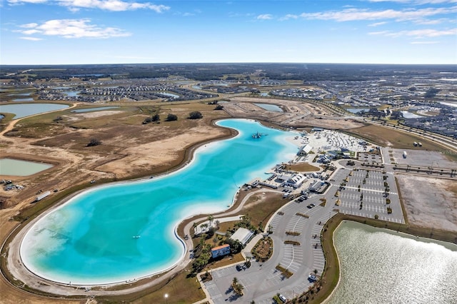 aerial view featuring a water view and a view of the beach