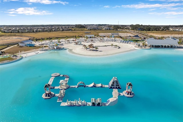 drone / aerial view with a view of the beach and a water view