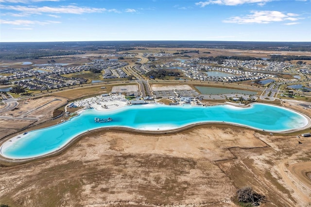 view of swimming pool featuring a water view