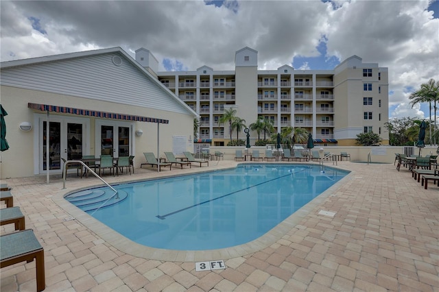 view of swimming pool with a patio