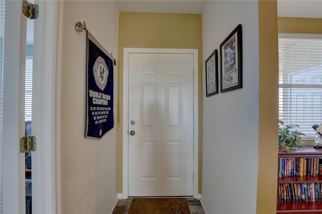 1200 Country Club Dr Unit 2504, Largo, FL 33771 - doorway to outside featuring baseboards