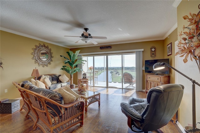 living room featuring hardwood / wood-style floors, crown molding, and a textured ceiling