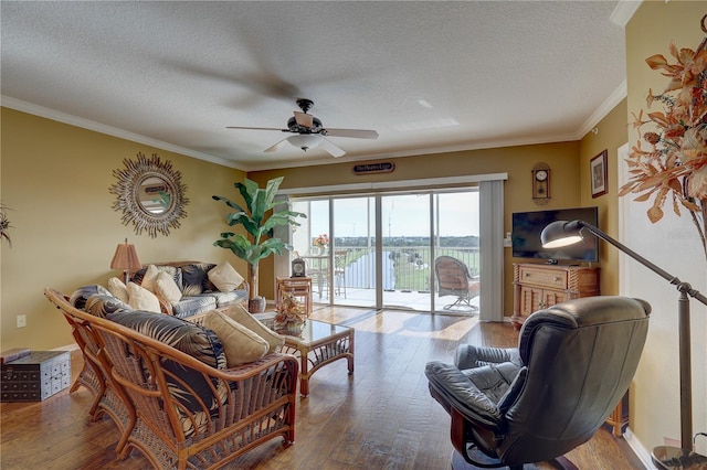 1200 Country Club Dr Unit 2504, Largo, FL 33771 - living room with ceiling fan, hardwood / wood-style flooring, ornamental molding, and a textured ceiling