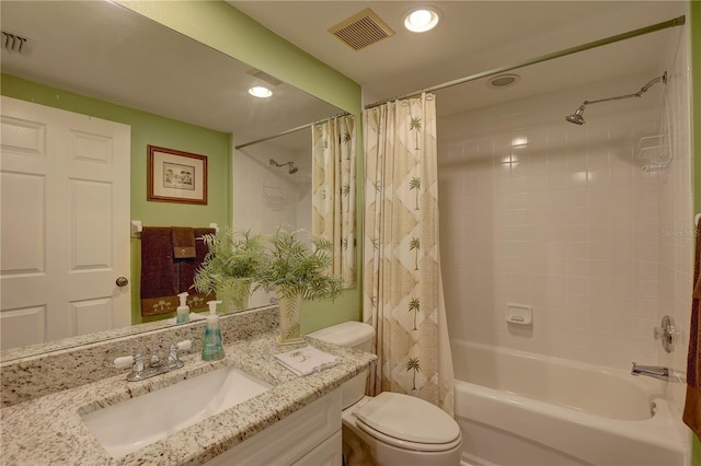 full bathroom with shower / tub combo, vanity, and toilet