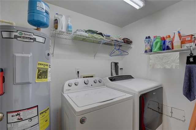 washroom with independent washer and dryer and water heater