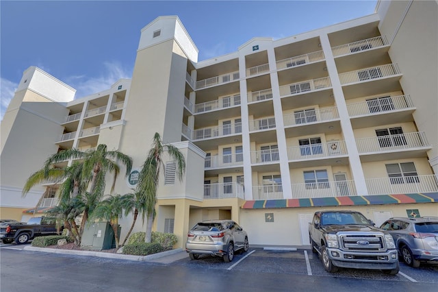 1200 Country Club Dr Unit 2504, Largo, FL 33771 - view of apartment building / complex with uncovered parking