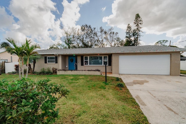 ranch-style home with a front lawn and a garage