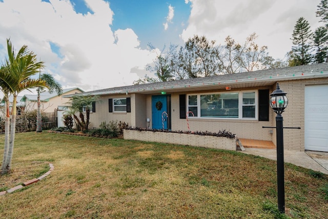 ranch-style house with a front lawn and a garage