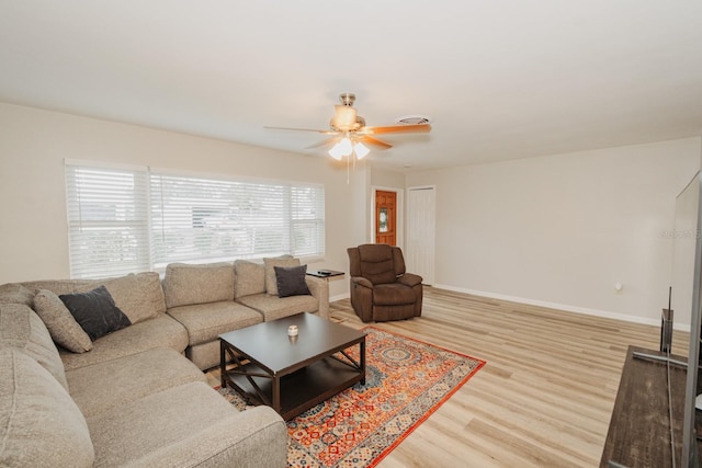 living room with hardwood / wood-style floors and ceiling fan