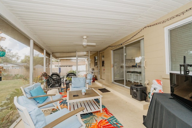 sunroom / solarium with ceiling fan