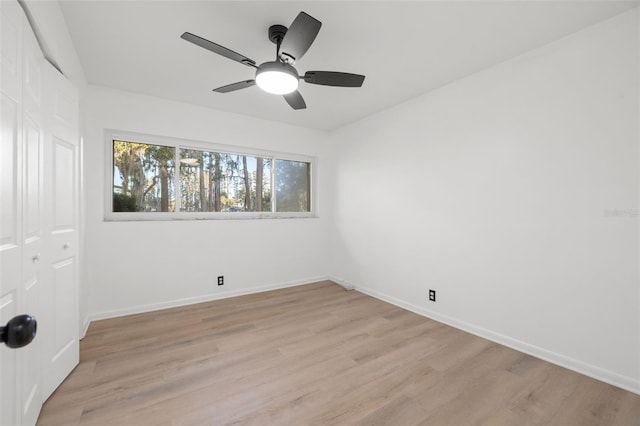 empty room featuring ceiling fan and light hardwood / wood-style flooring