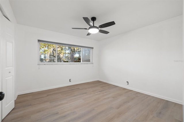 spare room with ceiling fan and light hardwood / wood-style flooring