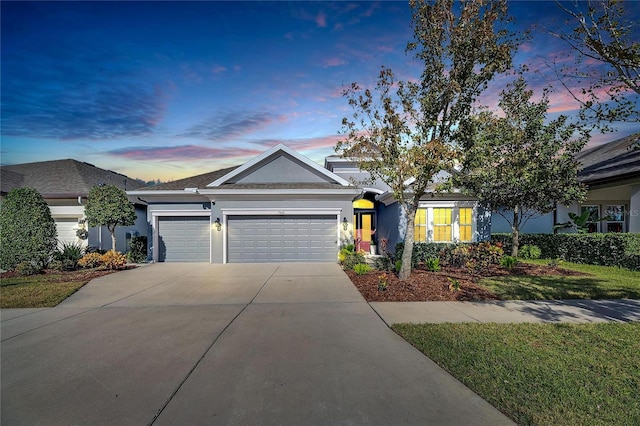 7506 Parkshore Dr, Apollo Beach, FL 33572 - view of front of property featuring stucco siding, a garage, and concrete driveway