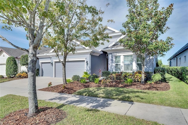 7506 Parkshore Dr, Apollo Beach, FL 33572 - view of front of house featuring an attached garage, concrete driveway, stucco siding, and a front lawn