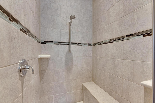 bathroom featuring tiled shower