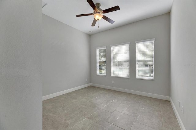 spare room with ceiling fan