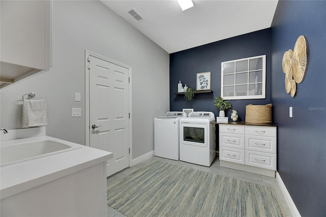 7506 Parkshore Dr, Apollo Beach, FL 33572 - laundry room featuring washer and dryer, cabinet space, and light tile patterned floors