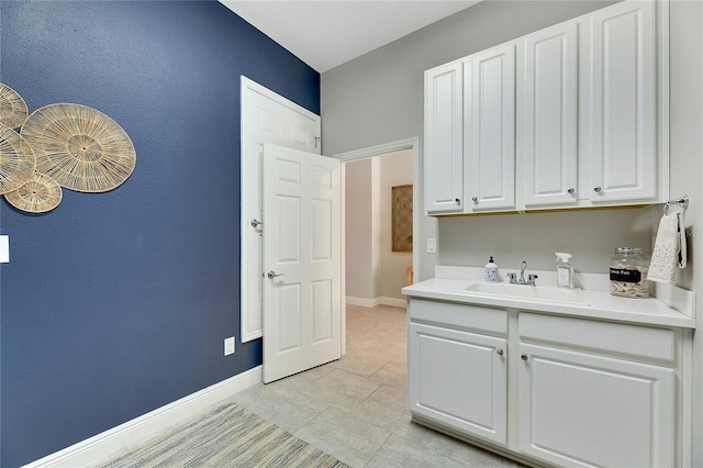 clothes washing area featuring sink