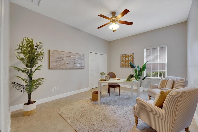 sitting room featuring ceiling fan and light tile patterned flooring